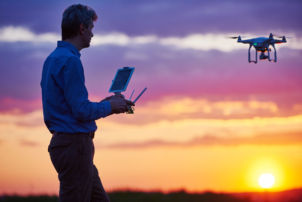 A man flying a drone