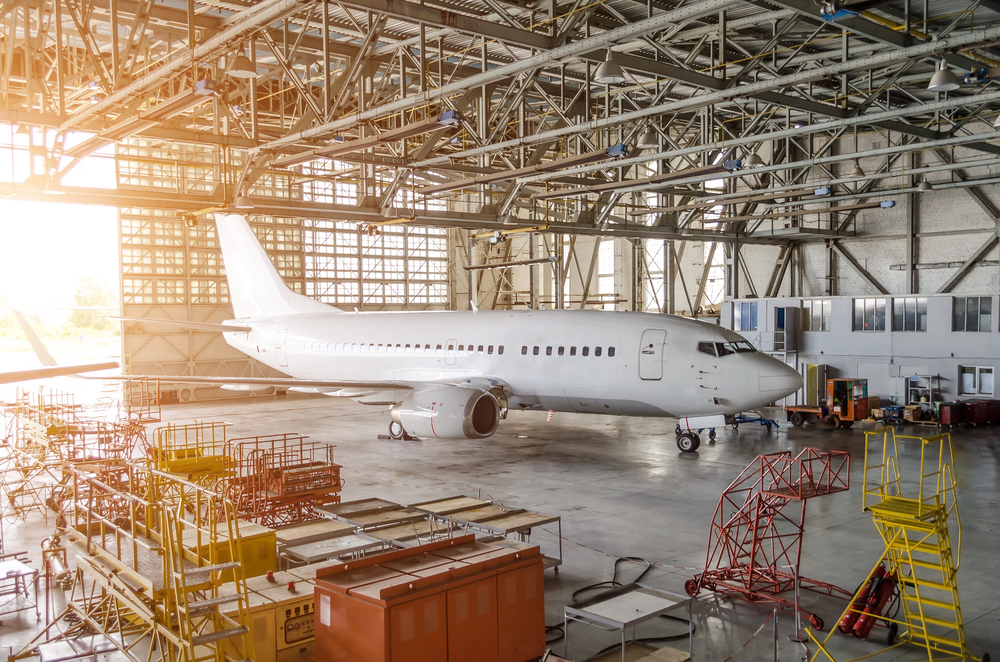a private jet aircraft in a hangar