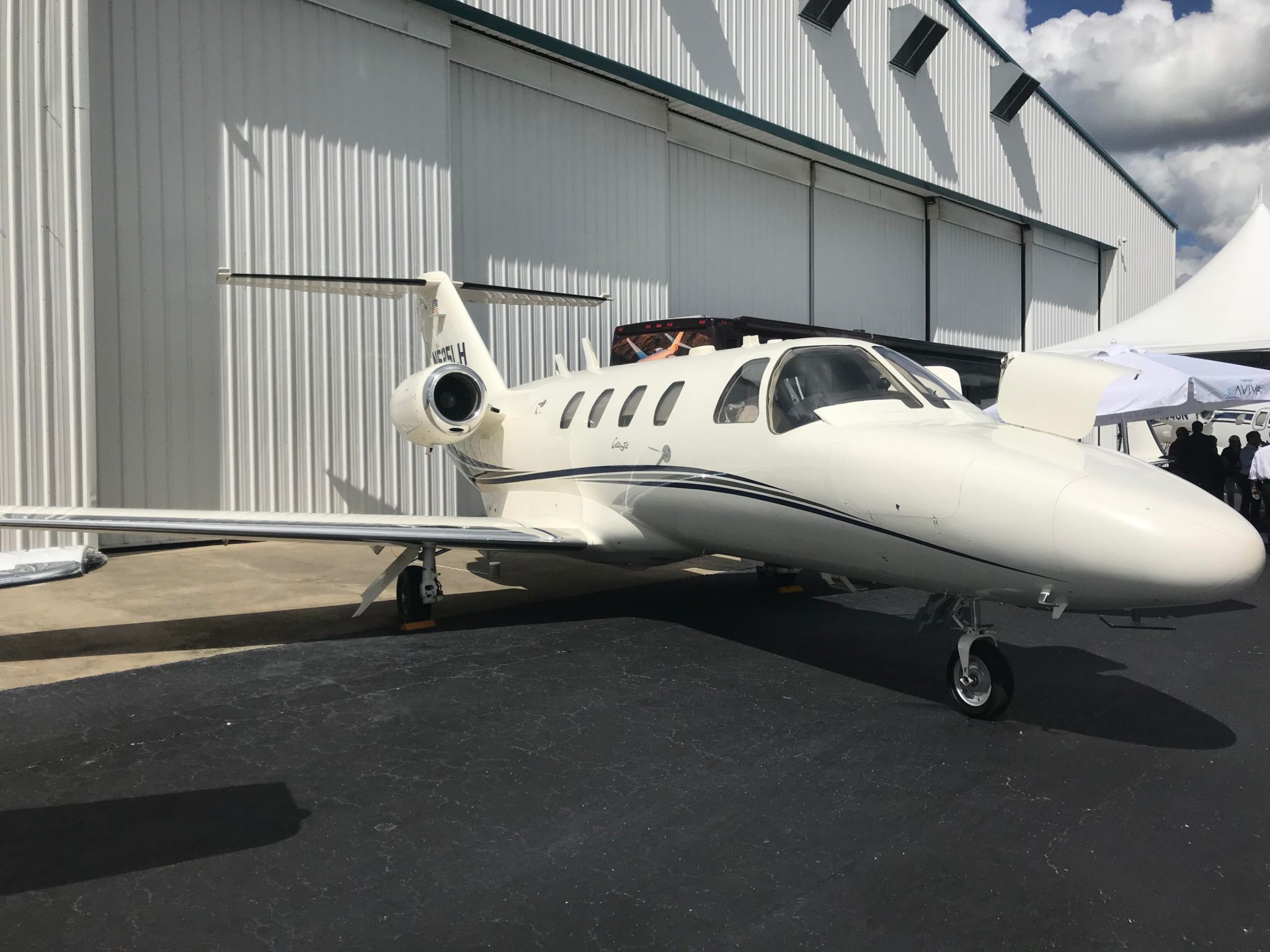 Private jet parked in front of hangar insurance